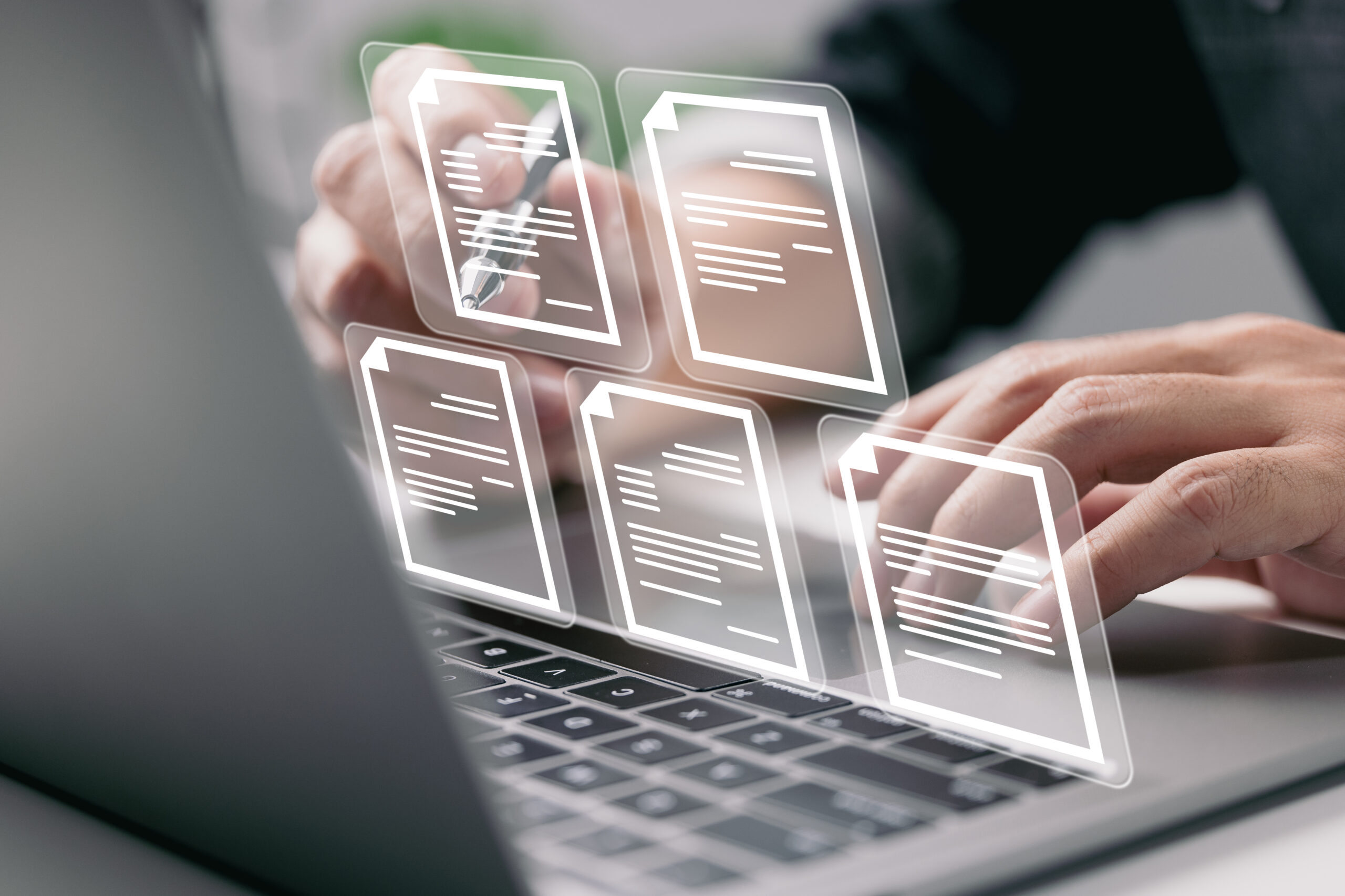 Business professional managing digital IT documentation on a laptop.