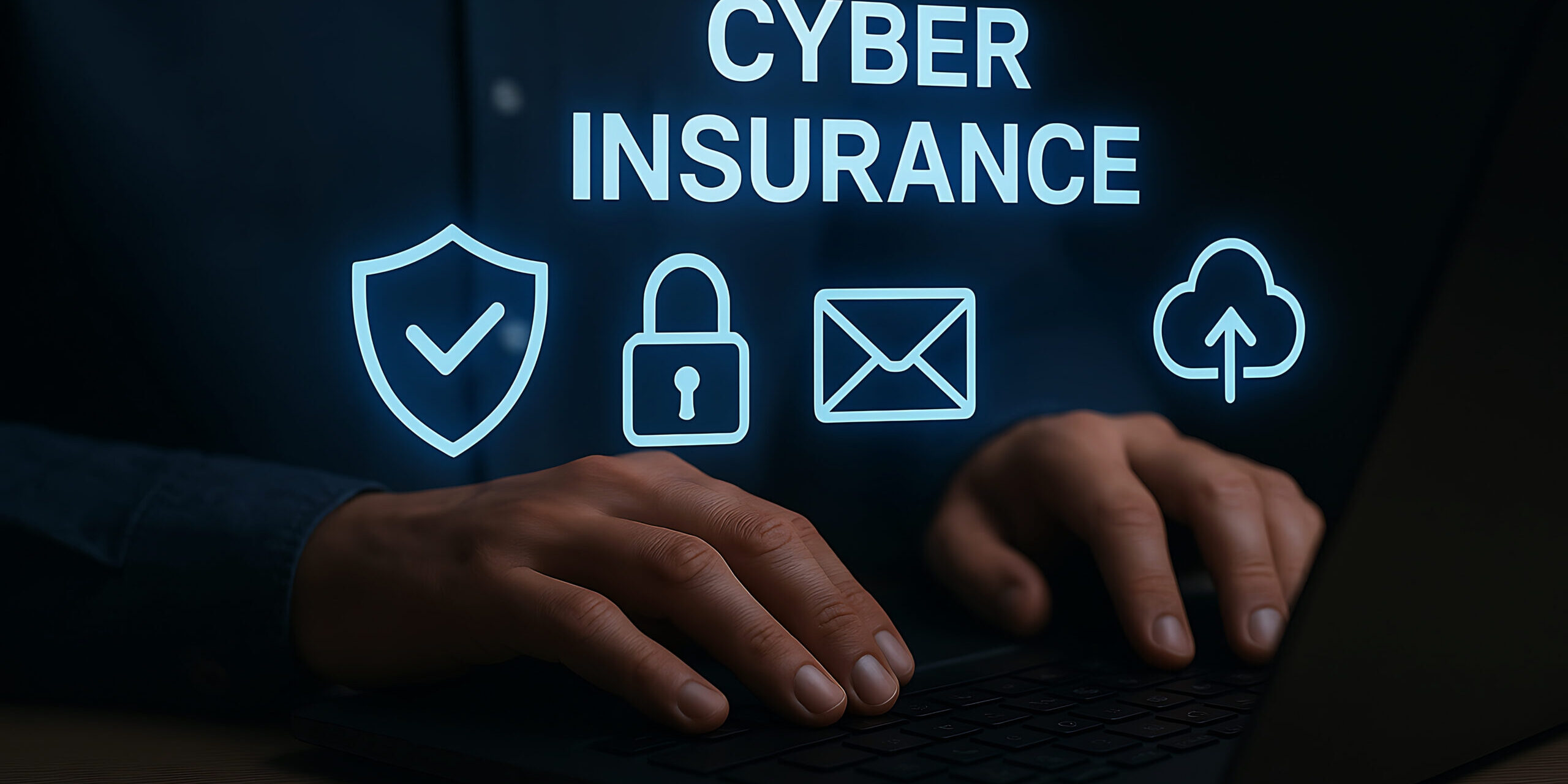 Hands typing on a laptop with glowing cybersecurity icons and the words “Cyber Insurance,” symbolizing digital protection for small businesses.