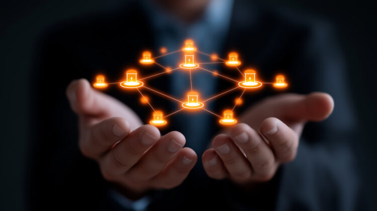 Hands holding a glowing segmented network diagram with secure connection nodes, symbolizing network segmentation and cybersecurity protection.