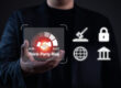 Business professional holding a digital icon representing third-party risk management with security, compliance, and governance symbols.