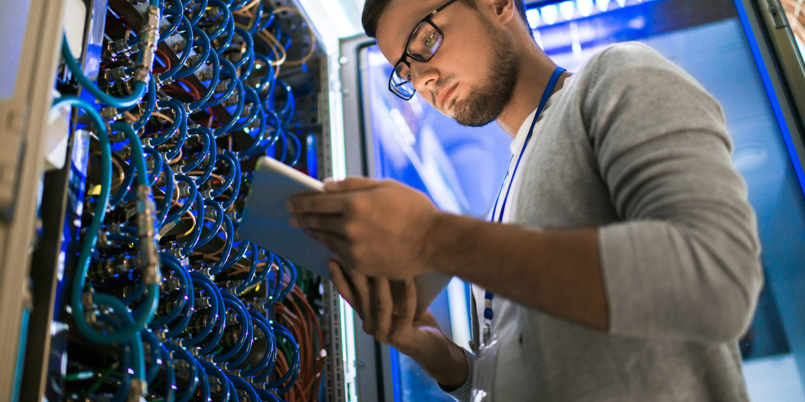 IT technician performing real-time network monitoring and maintenance as part of managed IT services for a small business