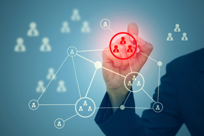 Business professional highlighting a segmented network diagram with access controls