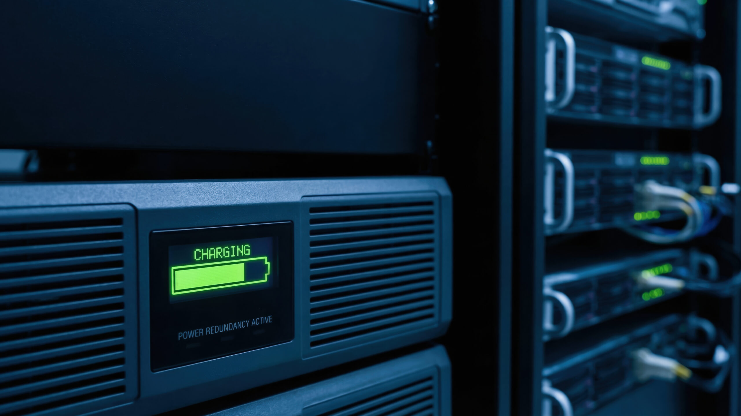 UPS battery backup system installed in a server rack providing backup power and surge protection for business IT infrastructure during a power outage.