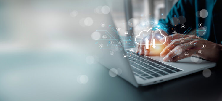 Person using a laptop with cloud storage interface and security icons representing secure cloud storage and data protection