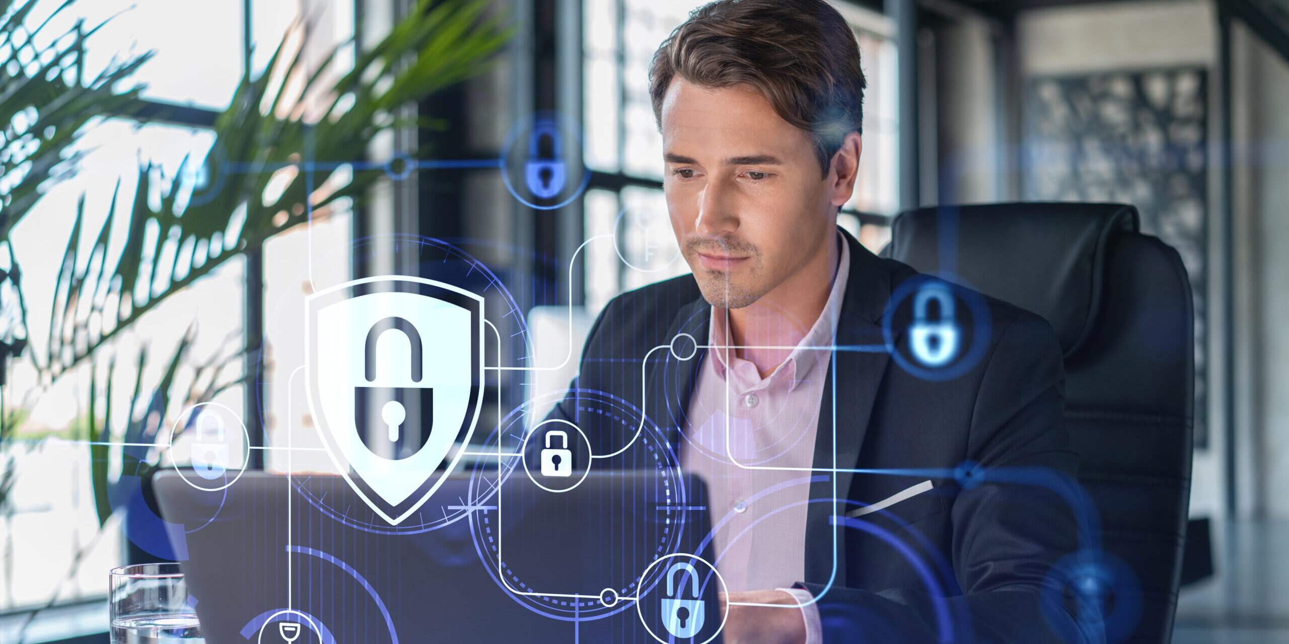 Common Microsoft 365 Security Mistakes Businesses Should Avoid Business professional working on a laptop with cybersecurity icons and digital security overlays, illustrating common Microsoft 365 security mistakes and data protection best practices.