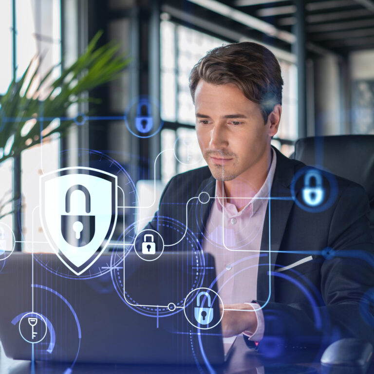 Business professional working on a laptop with cybersecurity icons and digital security overlays, illustrating common Microsoft 365 security mistakes and data protection best practices.